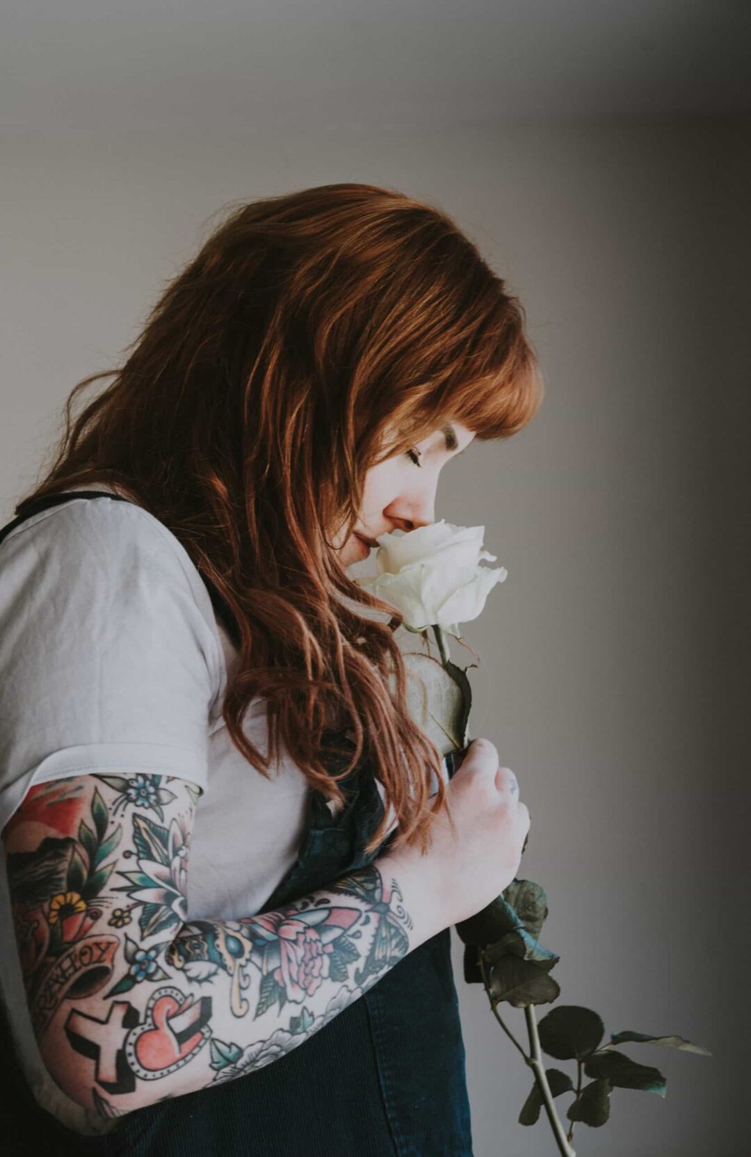 Person smelling rose