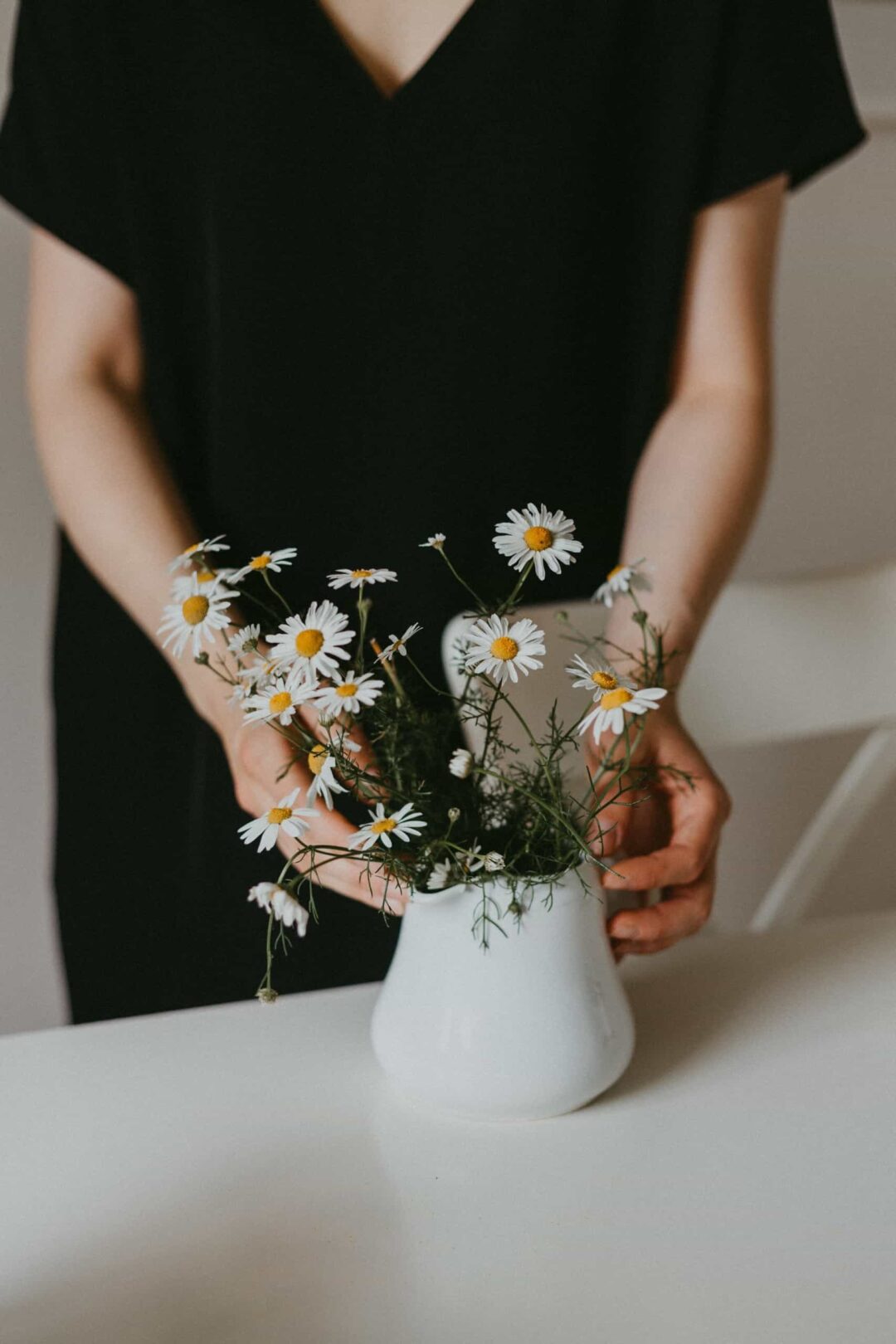 Person creating bouquet